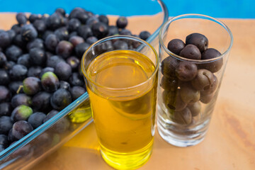 fresh olives from the garden and golden cold-pressed olive oil