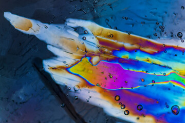 Rainbow polarized ice sheets macro closeup