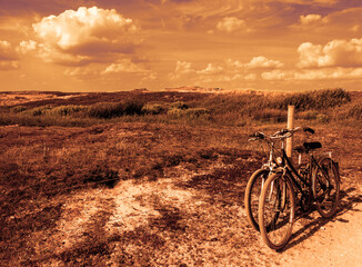 Two bicycles in countryside. Brittany, France. The concept of romance, love and simple everyday life. Toned photo.