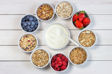 granola and cereals, various delicious ingredients for breakfast, top view, circle