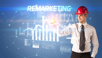 Young businessman with helmet drawing on virutal screen