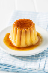 Sweet vanilla pudding. Sweet dessert with caramel topping.