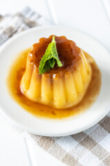 Sweet vanilla pudding. Sweet dessert with caramel topping.