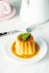 Sweet vanilla pudding. Sweet dessert with caramel topping.