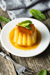 Sweet vanilla pudding. Sweet dessert with caramel topping.