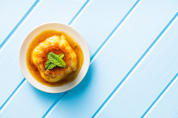 Sweet vanilla pudding. Sweet dessert with caramel topping.