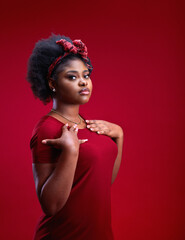 portrait of young woman on red background