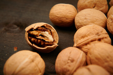 whole walnuts and broken walnut close-up