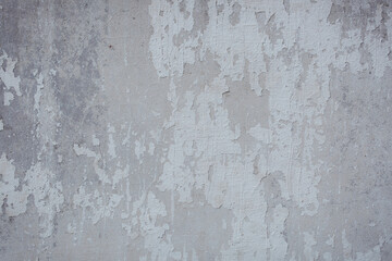 The texture of the old stucco wall with scratches, cracks, dust, crevices, roughness. Can be used as a poster or background for design.