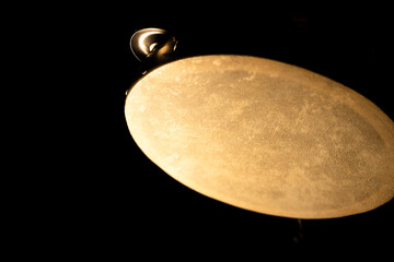Moonlike Upside Down Tambourine Isolated in Darkness