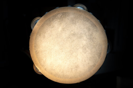 Isolated Top Down View of Top of Tambourine on Black Background