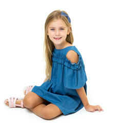 Charming little girl sitting on floor