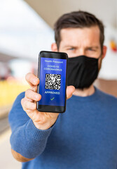 health Vaccine Passport for Coronavirus or Covid-19. Traveller Using Mobile Phone with Vaccination in Immune Status to Certificated International Traveling in train station