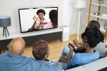 African Family Watching TV Movie