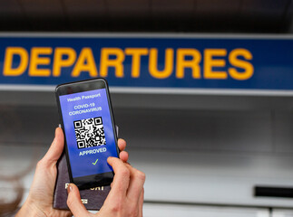 health Vaccine Passport for Coronavirus or Covid-19. Traveller Using Mobile Phone with Vaccination in Immune Status to Certificated International Traveling in Airport
