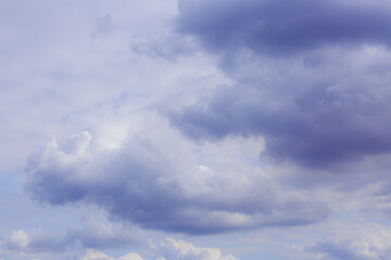 Fototapeta na wymiar Cumulus clouds. Beautiful dark blue dramatic sky. Free space for lettering.