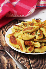 Polish dish kopytka served at the table