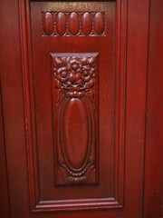 A classical wooden door with floral carvings