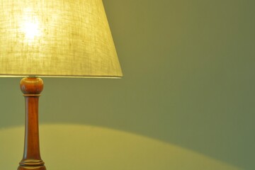 dim lighting room of the mahogany antique lamp. 

This expensive furniture is made in England. 
blurred background soft focus image.	