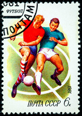 A stamp printed in the USSR shows football