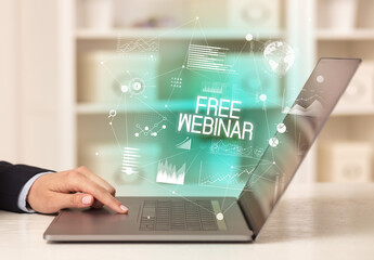 Side view of a business person working on laptop