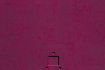 Dark pink metal texture with a rough surface. Traces of corrosion and elements of paint streaks and fading in the sun.