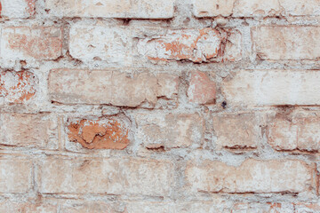 An old brick wall with natural defects. High resolution white brick wall texture. Lots of scuffs, chips and scratches.