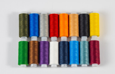 Multi-colored spools of thread. Close-up. View from above.
