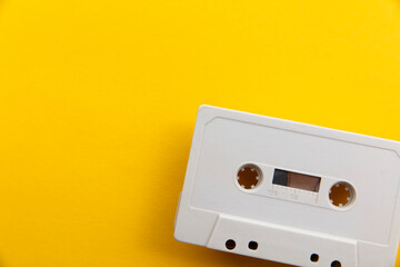 Obraz premium vintage white cassette tape on a bright yellow background