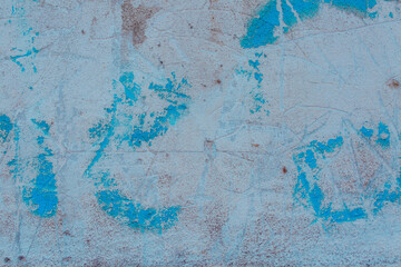 Blue concrete wall with natural defects. Fragment of the cement surface with natural texture. Monochrome palette of shades.