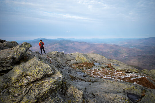 Hikers enjoy the view from the top of Camel's Hump in Vermont, Green Mountains