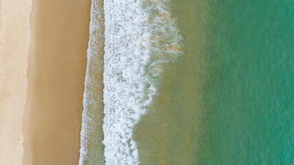 Aerial view of the ocean waves washing on the coast of the Andaman ocean Amazing top down nature Landscape seascape view beautiful for travel background and website