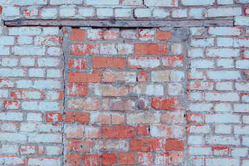 Old shabby wall with elements of destroyed bricks. Can be used as background for design or poster.