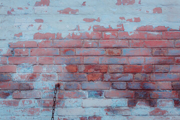 Old shabby wall with elements of destroyed bricks. Can be used as background for design or poster.