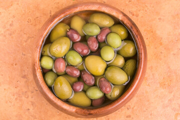 plate with olives on a light background