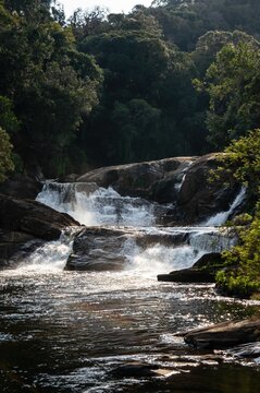 The beautiful and strong clear water current of Barracao waterfall. This is one of many cascades of Paraibuna river that runs in the middle of Sea Ridge dense jungle in Cunha, Sao Paulo - Brazil.