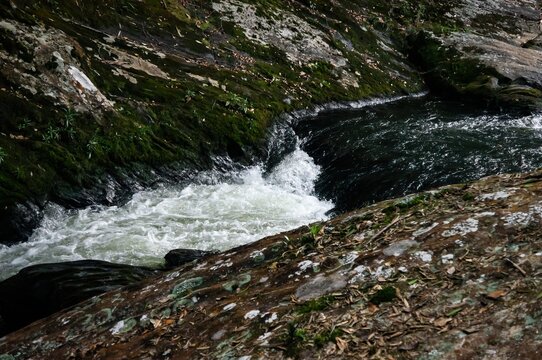 A beautiful clear water current from Paraibuna river. This is one of many sections of the river that runs in the middle of Sea Ridge dense jungle in Cunha, Sao Paulo - Brazil.