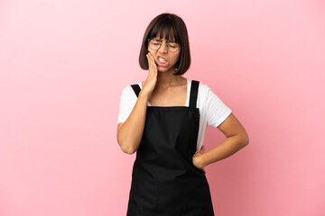 Restaurant waiter over isolated pink background with toothache
