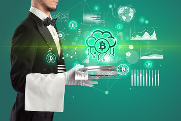 Handsome young waiter in tuxedo holding currency icons on tray