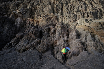 Women stand on hillside 