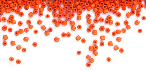 Close up of Orange Beads on the white background. Background or texture of beads. macro,It is used in finishing fashion clothes. make bead necklace or string of beads for woman of fashion.