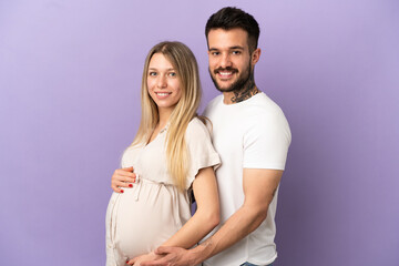Fototapeta premium Young couple pregnant and happy