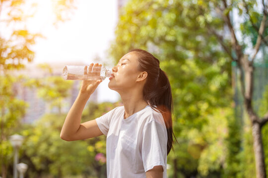 Girls Drink A Lot Of Water After Exercise