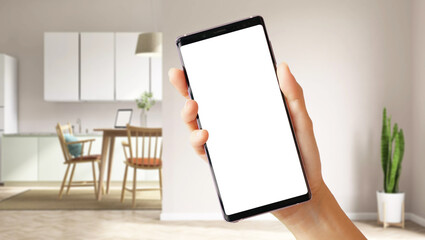 Smart home automation lifestyle with IoT technology concept. Close up of woman's hand holding white blank screen smartphone with modern 3D living room background. Clipping path.