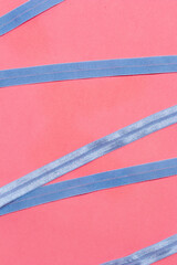 Blue zigzag ribbon on pink table