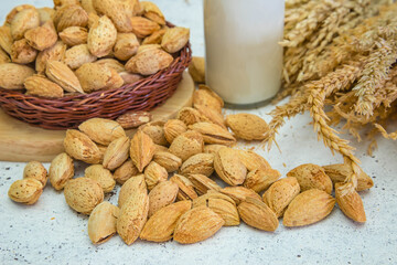 Arrangement of dried fruits almonds and walnuts on rustic old wooden table