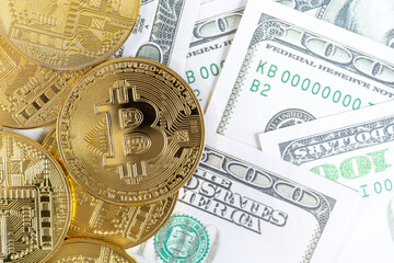 Bitcoin cryptocurrency golden coins and dollar bill in background