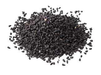 handful of Nigella sativa seeds closeup on white