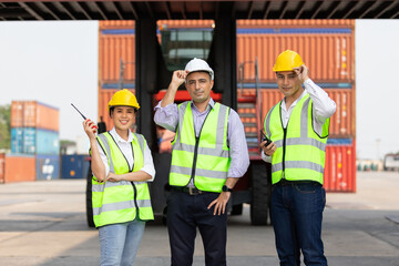 portrait smart factory workers or engineers in containers warehouse storage