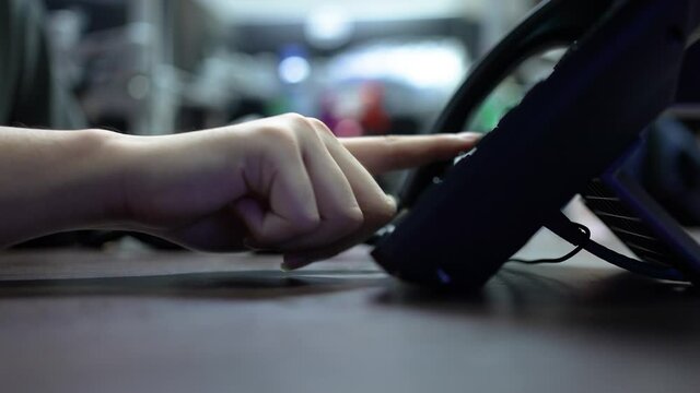 slow motion scene of  employee man hand press number to dial and touching handset of  telephone on desk for contact customer or receiving call for communication and helpdesk woking concept